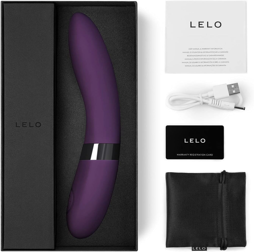 Full contents of box, including wand vibrator, charger, carrying pouch, and warranty/registration.