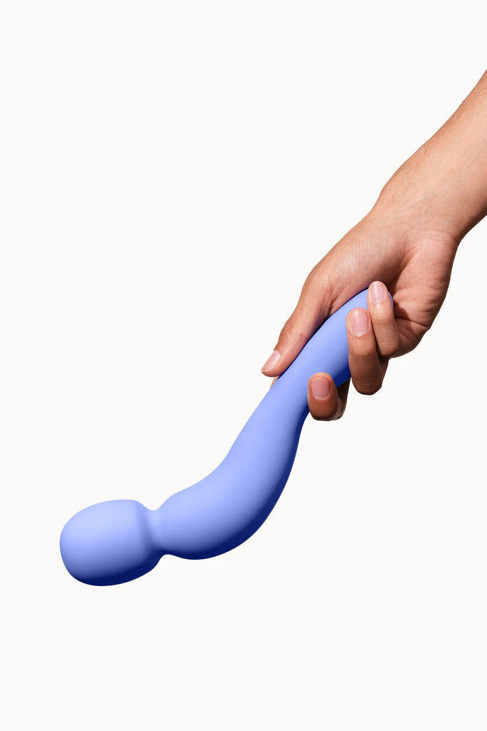 Hand holding Dame clitoral stimulation sex toy.