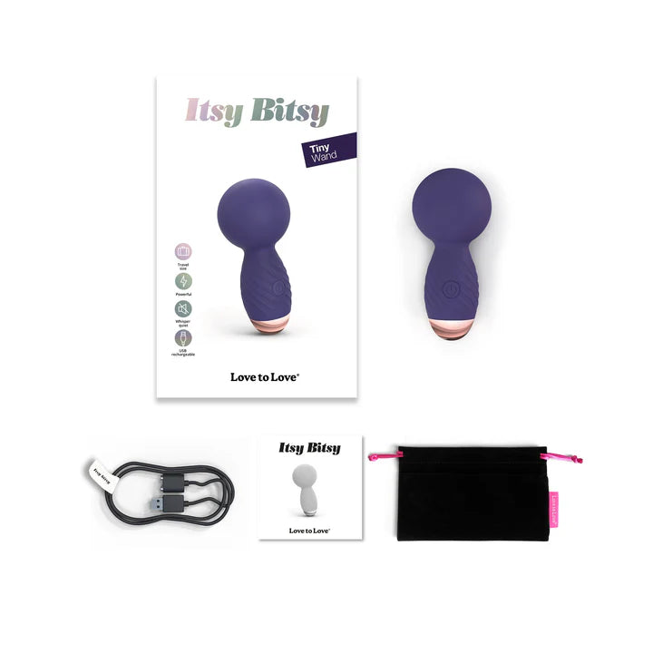 Full box contents for the Itsy Bitsy vibrator, including toy, charging cable, carrying pouch, and manual.