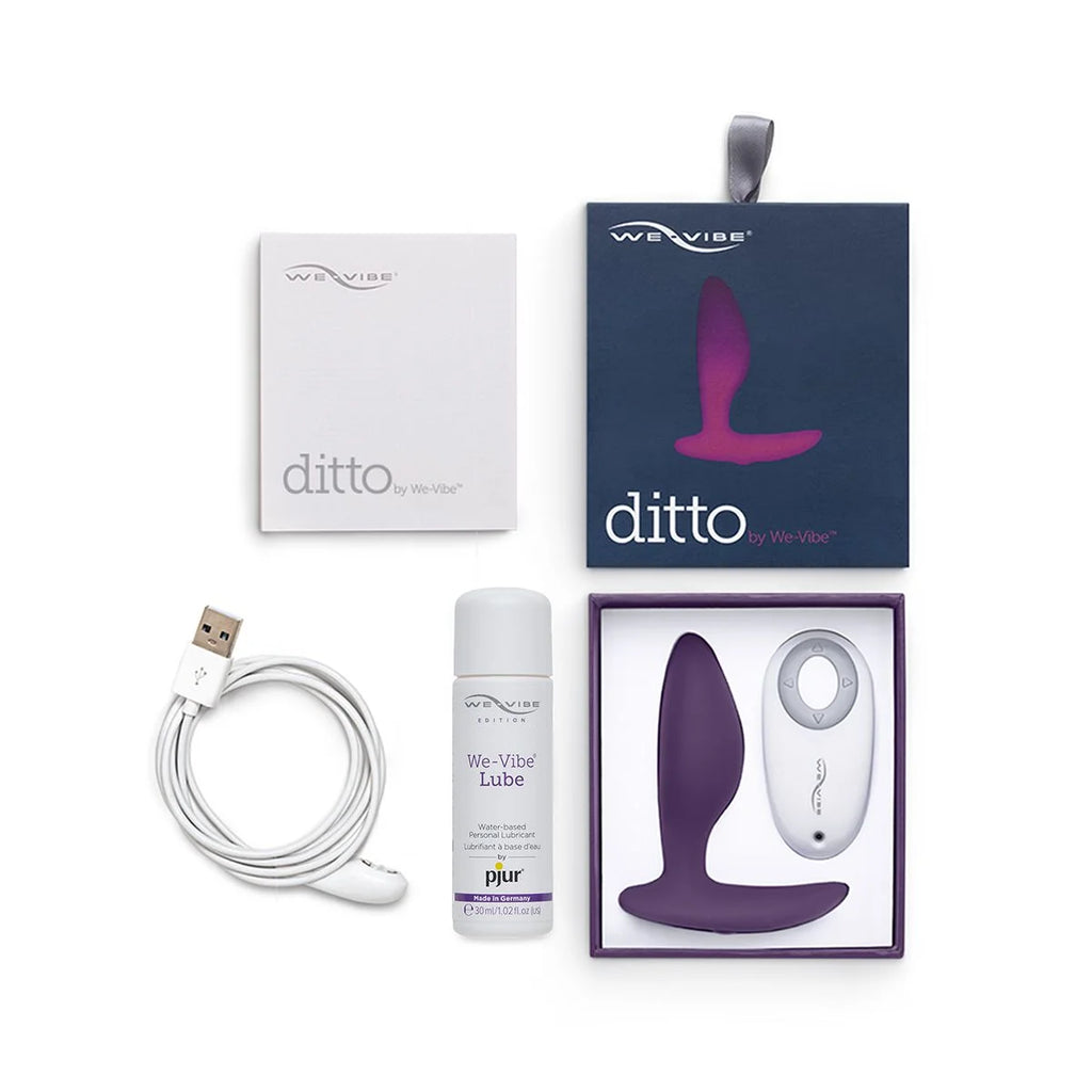 Full box contents of We-Vibe Ditto Vibrating Anal Plug, including vibrator, charger, sample lube, and warranty/manual.