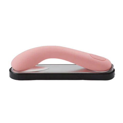 iroha mai toki pink vibrator on charging stand.