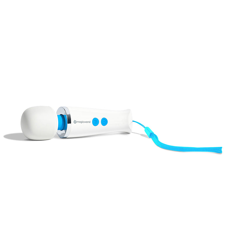 Magic Wand Micro pocket-sized vibrator. Close-up of product laying on side. White colour with light blue buttons.