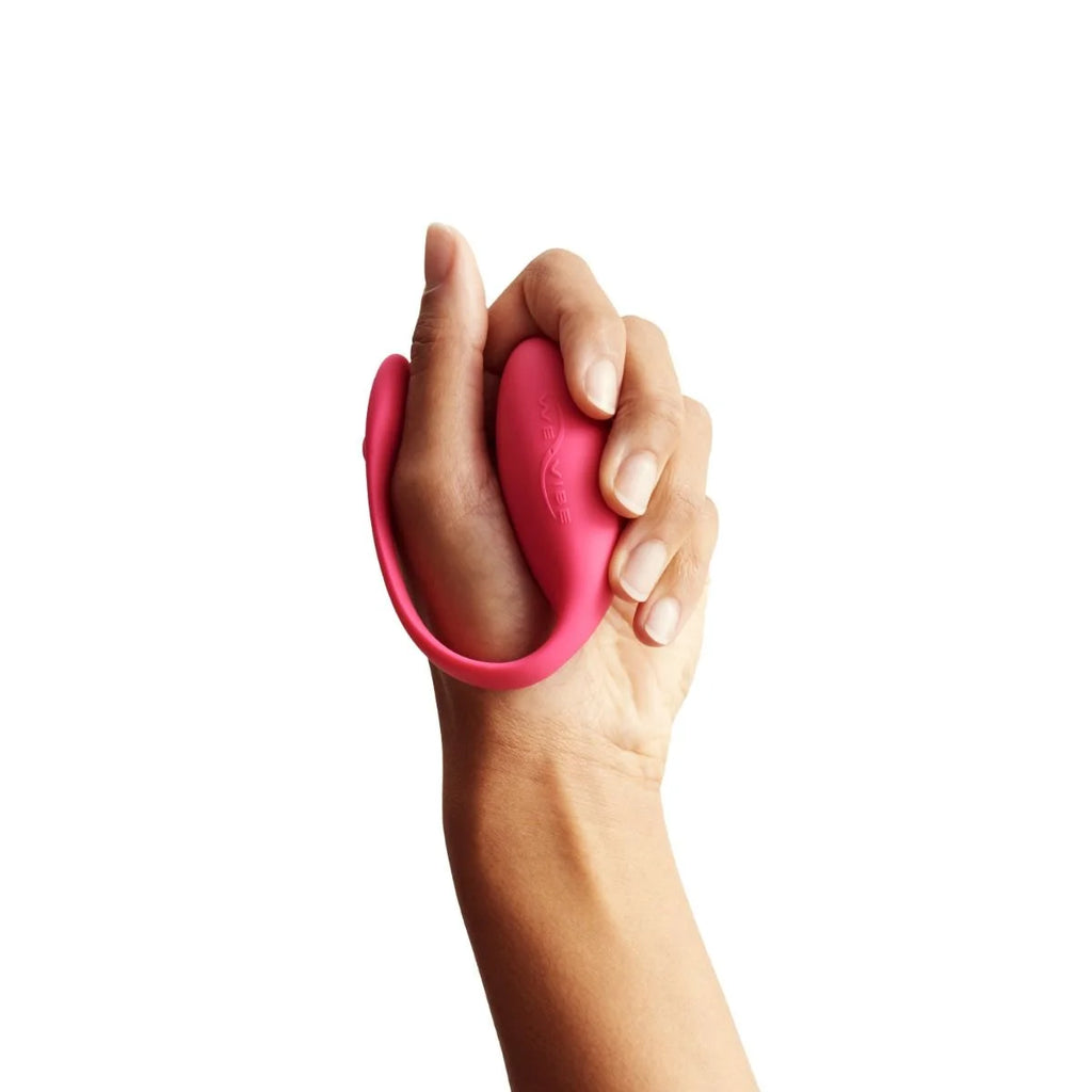 Wearable vibrator shown held in hand.