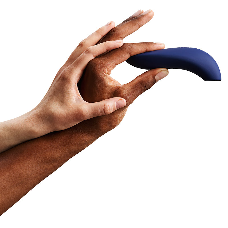Man and woman's hand holding blue vibrator.