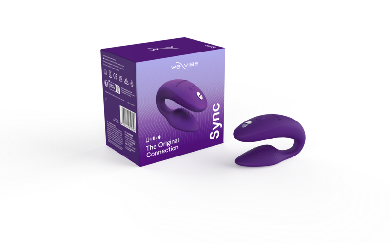 We-Vibe Sync Couple's Vibrator in purple, shown next to box.