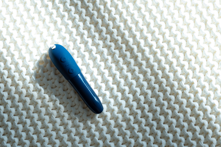 Close-up of blue We-Vibe Tango X, showing clickable buttons.