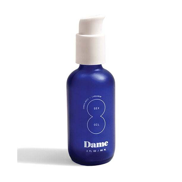 blue bottle of dame massage oil