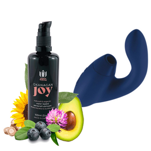 Womanizer Duo clitoral suction and G-Spot vibration toy in blueberry colour, next to Intimate Wellbeing's signature personal lubricant, Okanagan Joy.